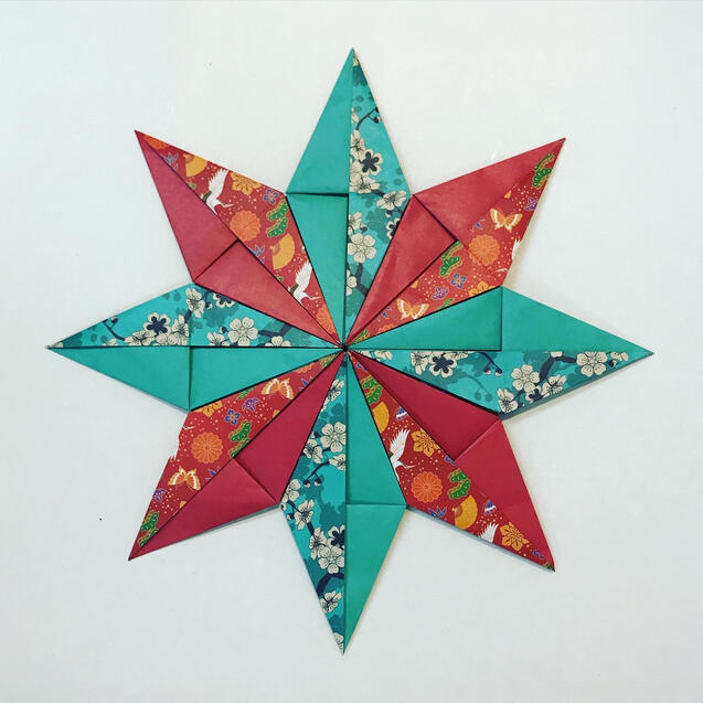 Origami 8 point star with 8 modules Origami 8 point star with 8 modules